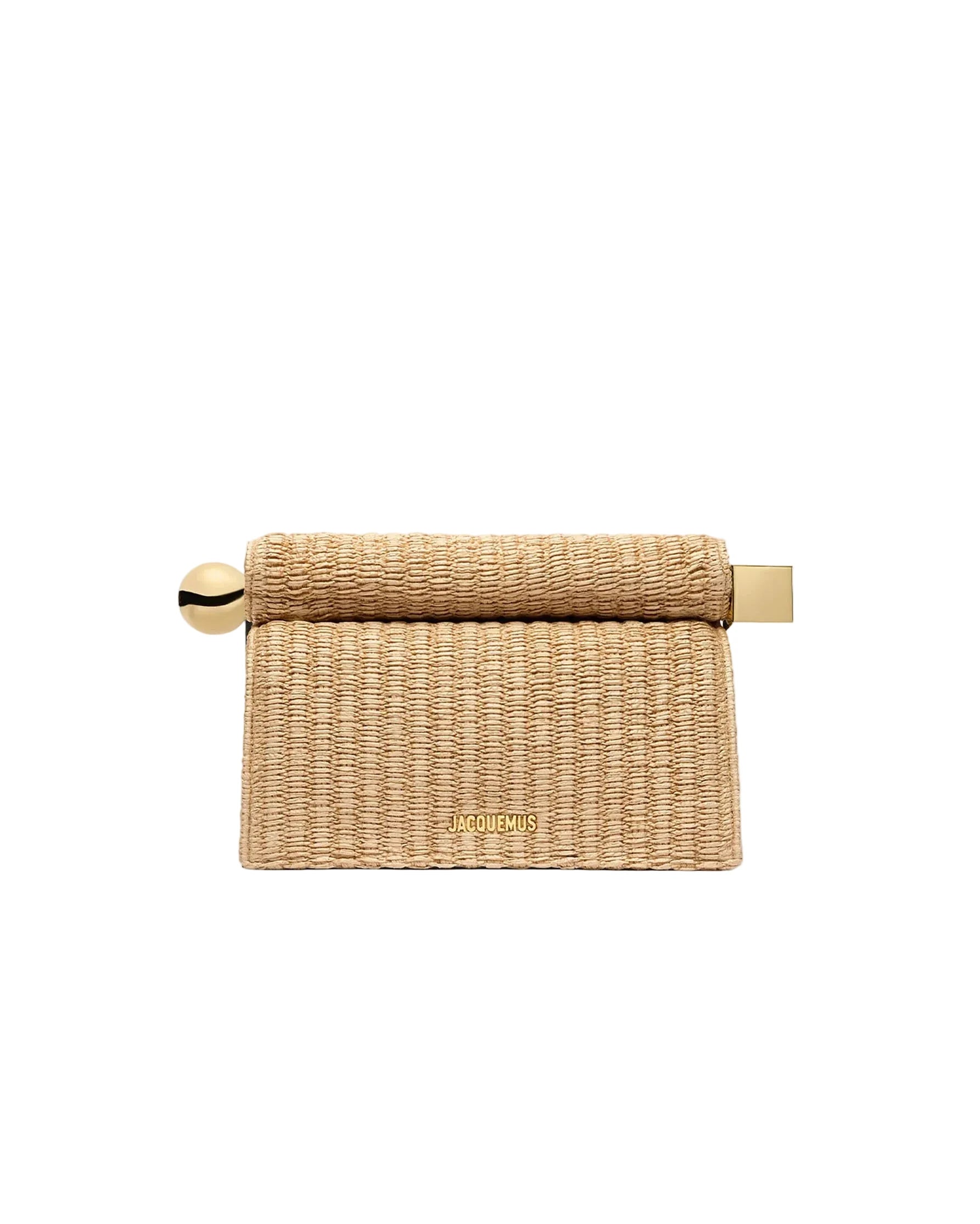 Woven napkin holder with gold accents on a white background