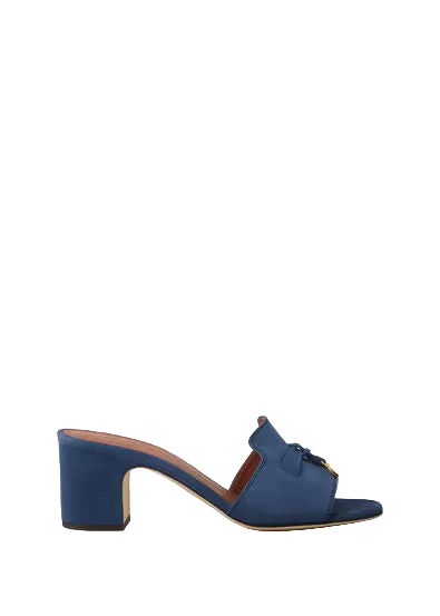Blue sandal with a block heel on a white background