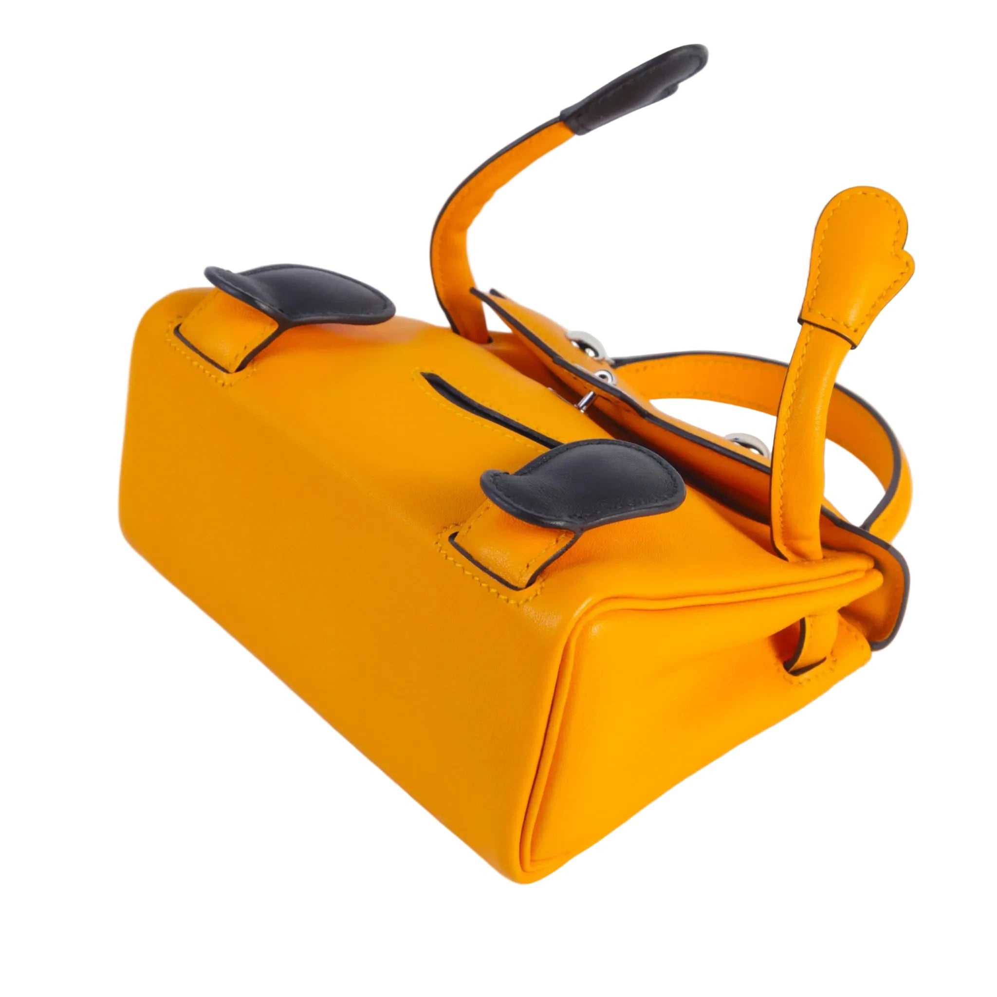 Bright yellow-orange leather handbag with black accents and a structured rectangular shape, photographed on a clean white background.