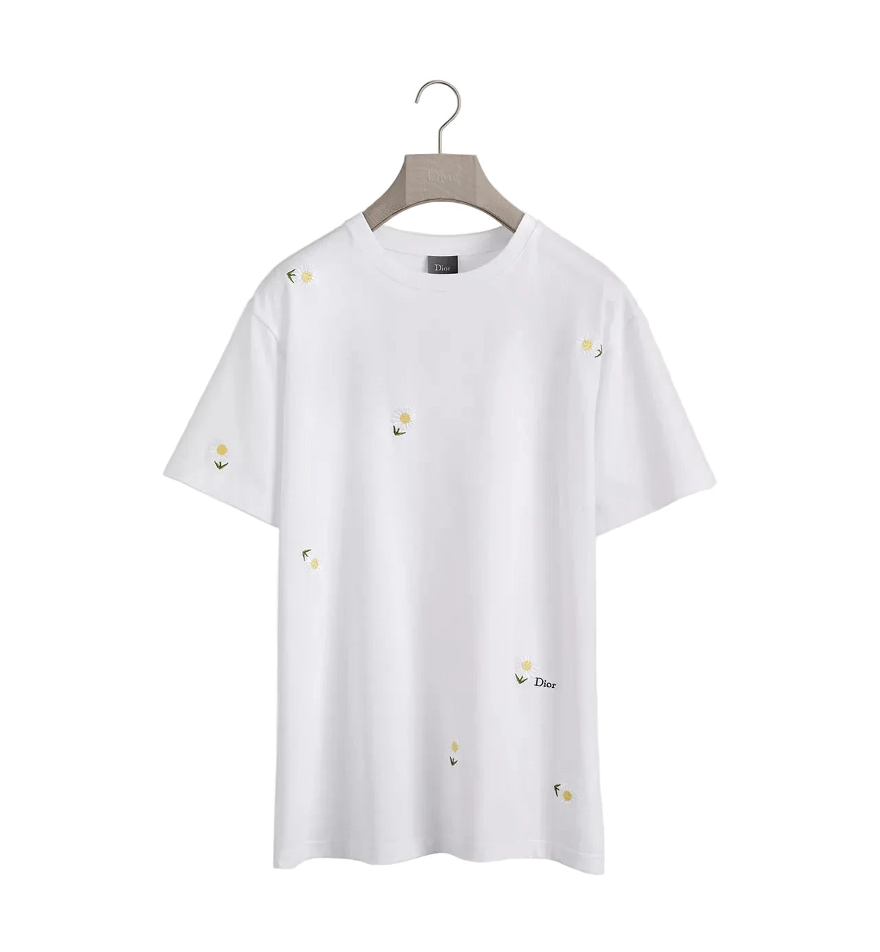 White t-shirt with small embroidered designs on a hanger against a white background