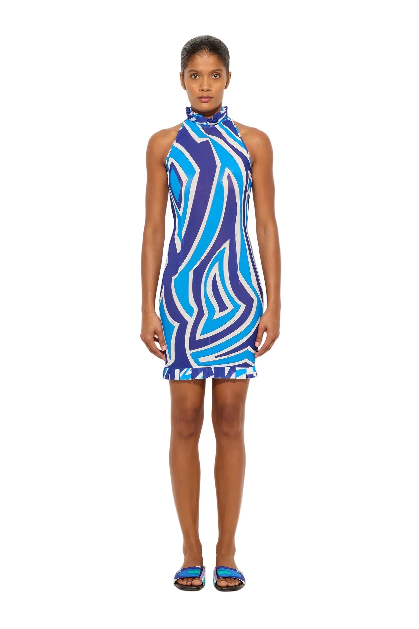 Woman wearing a blue and purple patterned dress on a white background