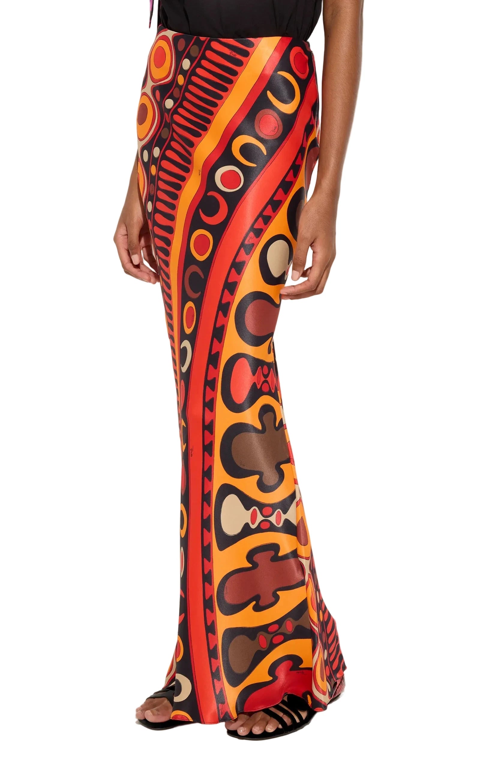Colorful patterned pants worn by a person on a white background