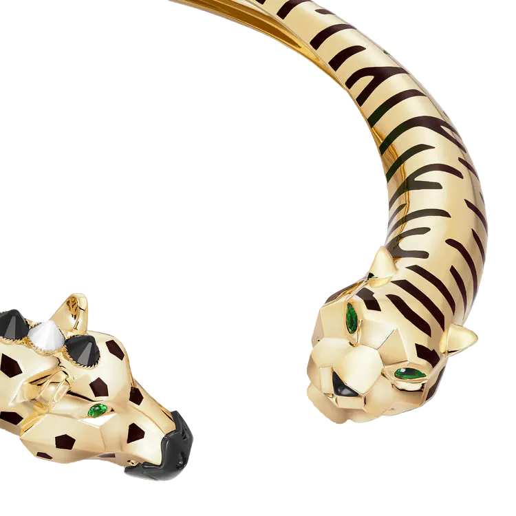 Gold tiger-shaped bracelet with detailed design on a light gray background