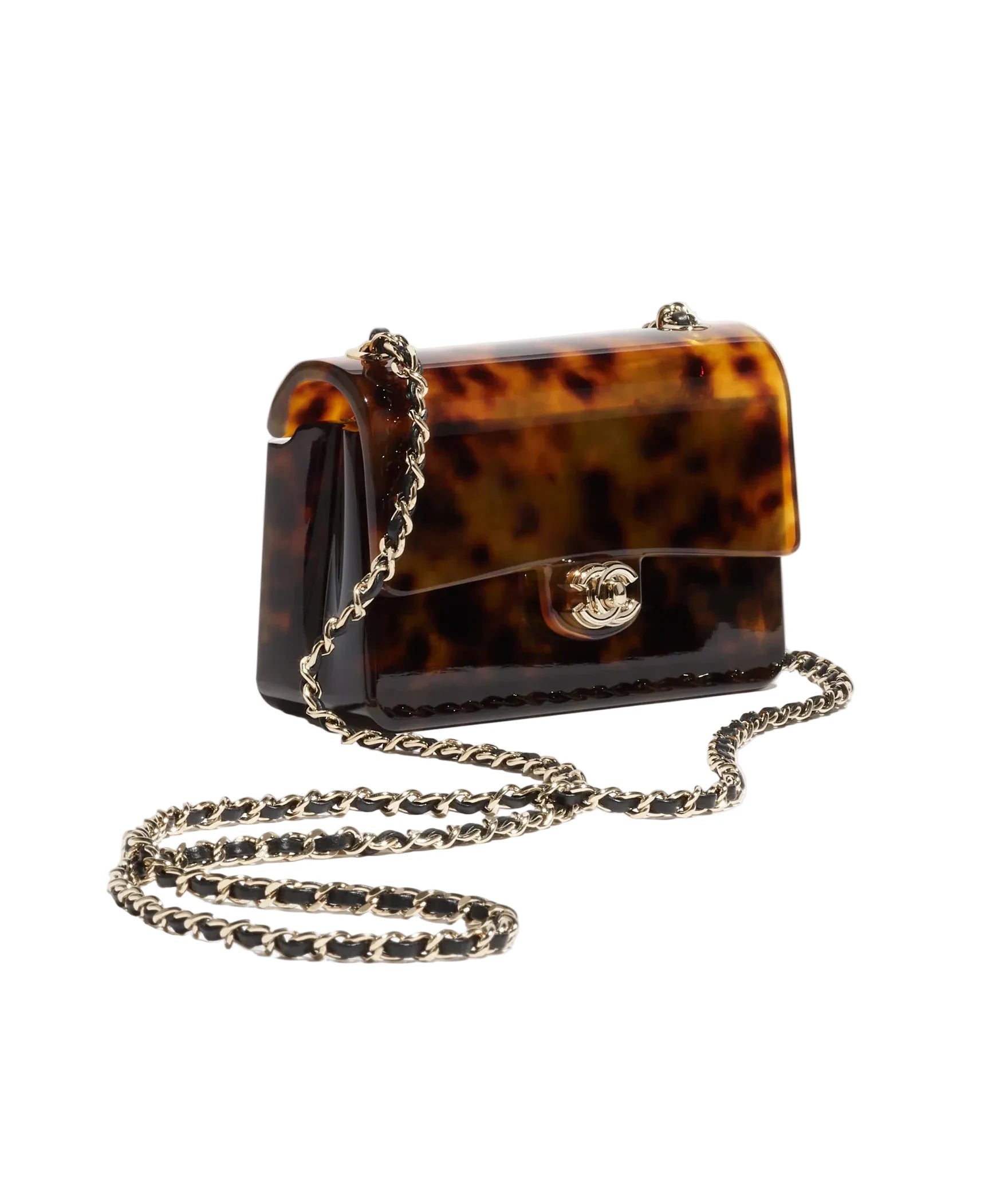 Tortoiseshell handbag with gold chain on a light gray background