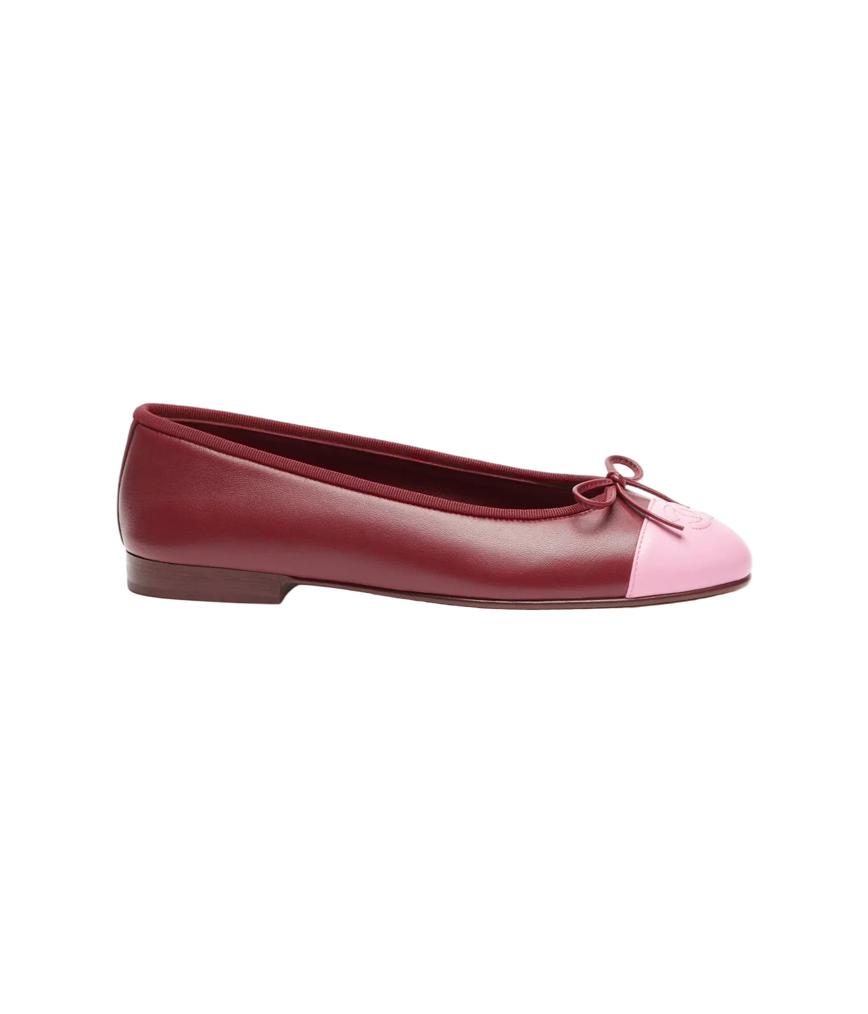Burgundy and pink flat shoe on a white background