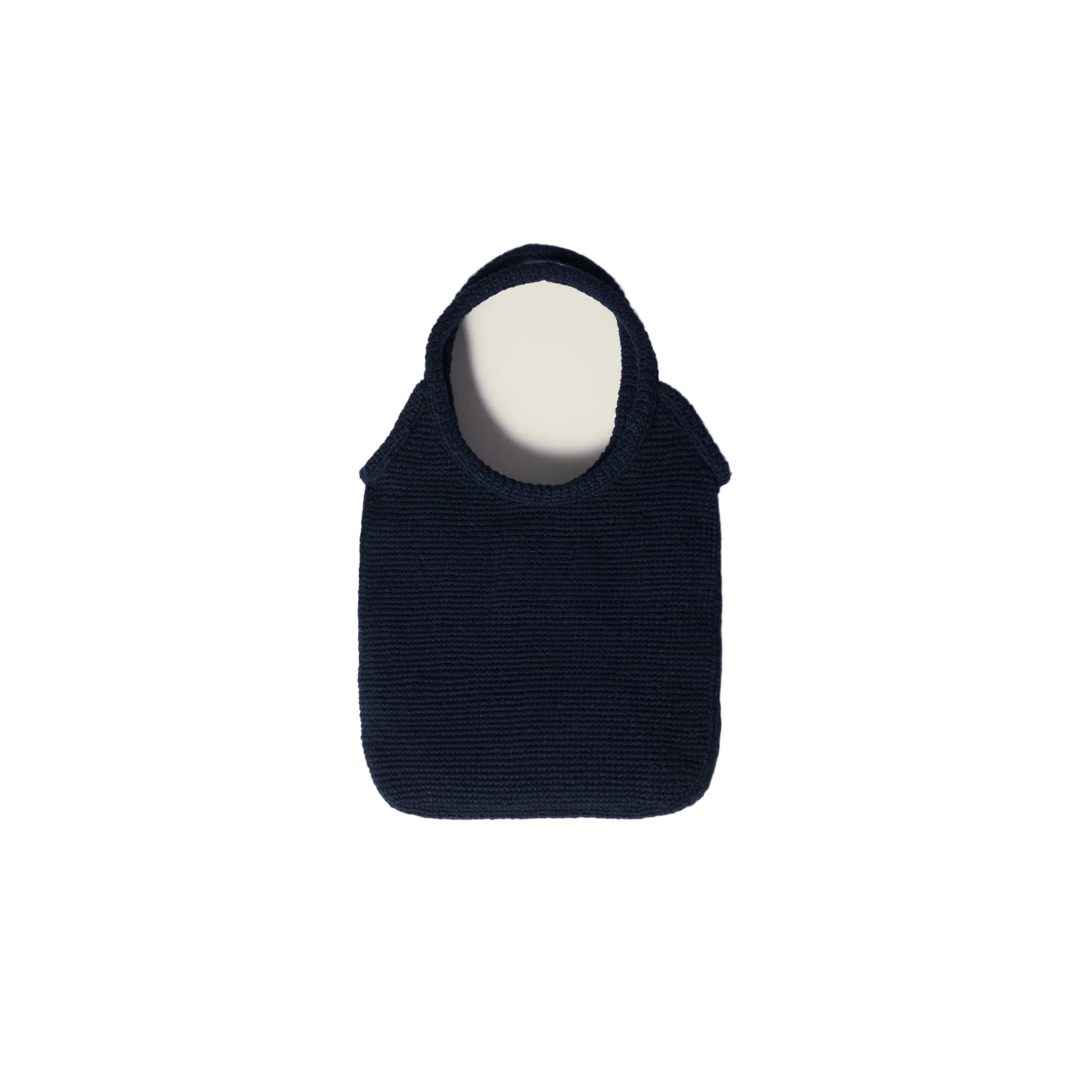 Black handbag on a beige background