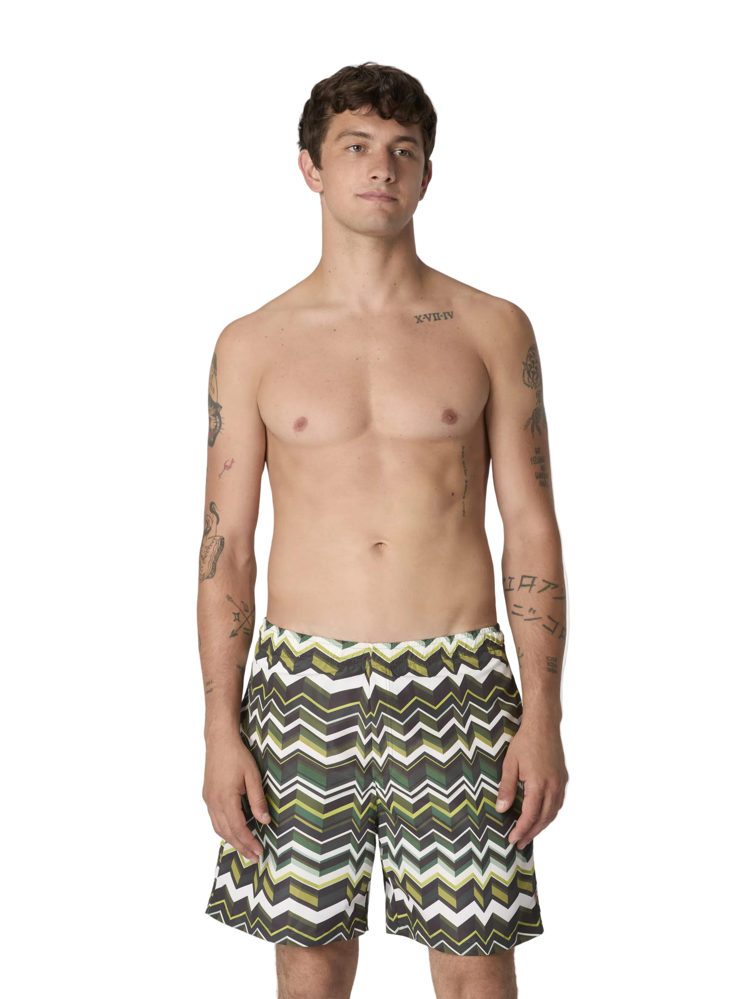 Man wearing a patterned swimsuit on a white background