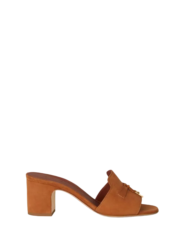 Brown sandal with a block heel on a white background