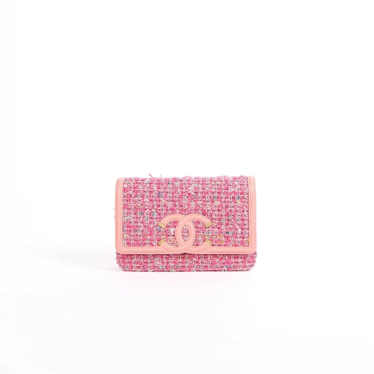 A small Chanel tweed wallet in pink and blue with a pink leather CC turn-lock closure, photographed on a clean white background.