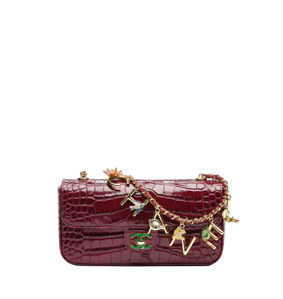 A burgundy crocodile-embossed leather handbag with gold-tone hardware and a decorative charm strap featuring interlocking 'C' and 'V' logos, a bell, and colorful enamel details, set against a plain white background.
