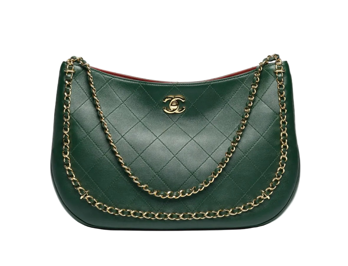 A dark green quilted leather shoulder bag with gold-tone chain straps and a gold interlocking CC logo on the front, set against a plain white background.