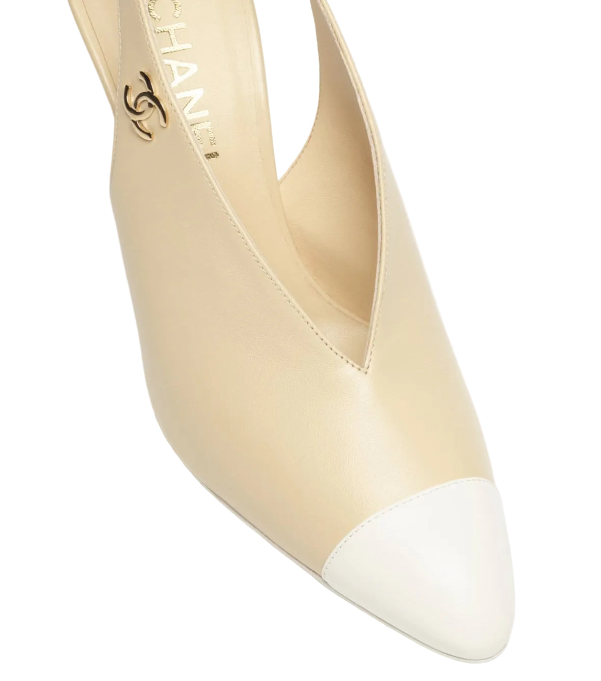 Beige high-heeled shoe with white cap toe on a light gray background