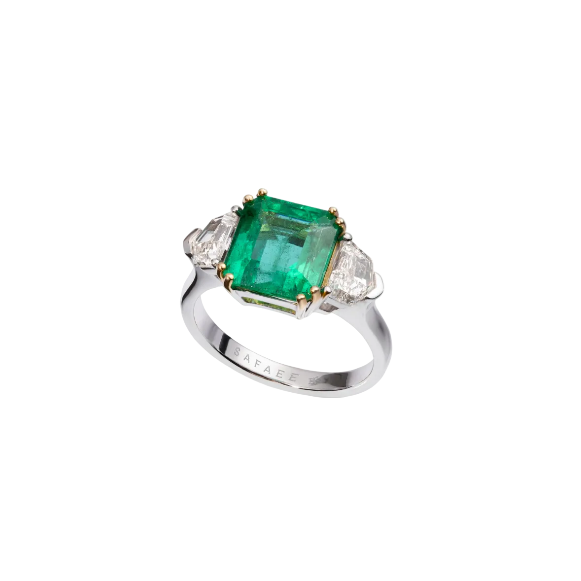 Silver ring with a green gemstone on a white background