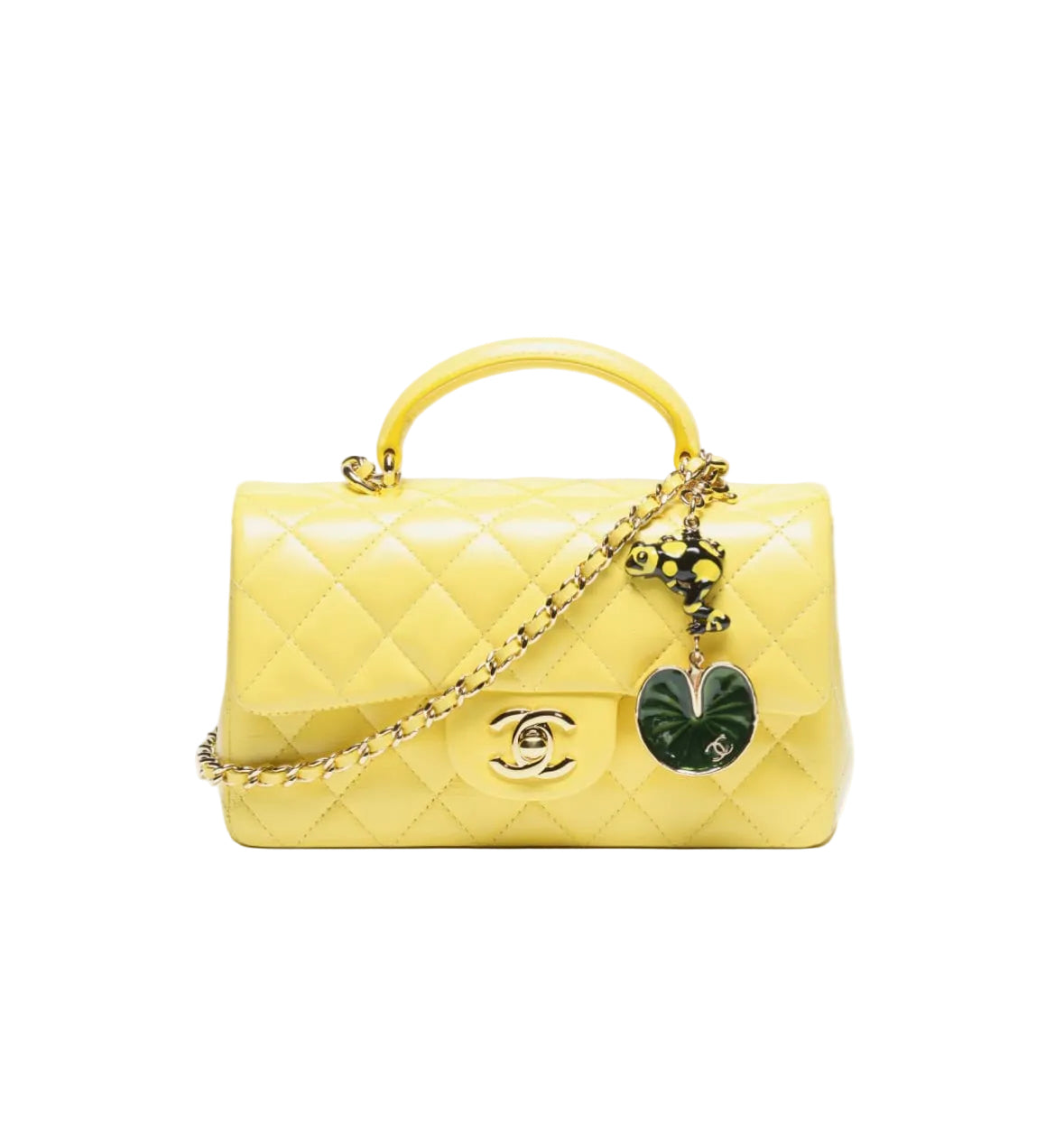 Yellow quilted handbag with a heart charm on a white background