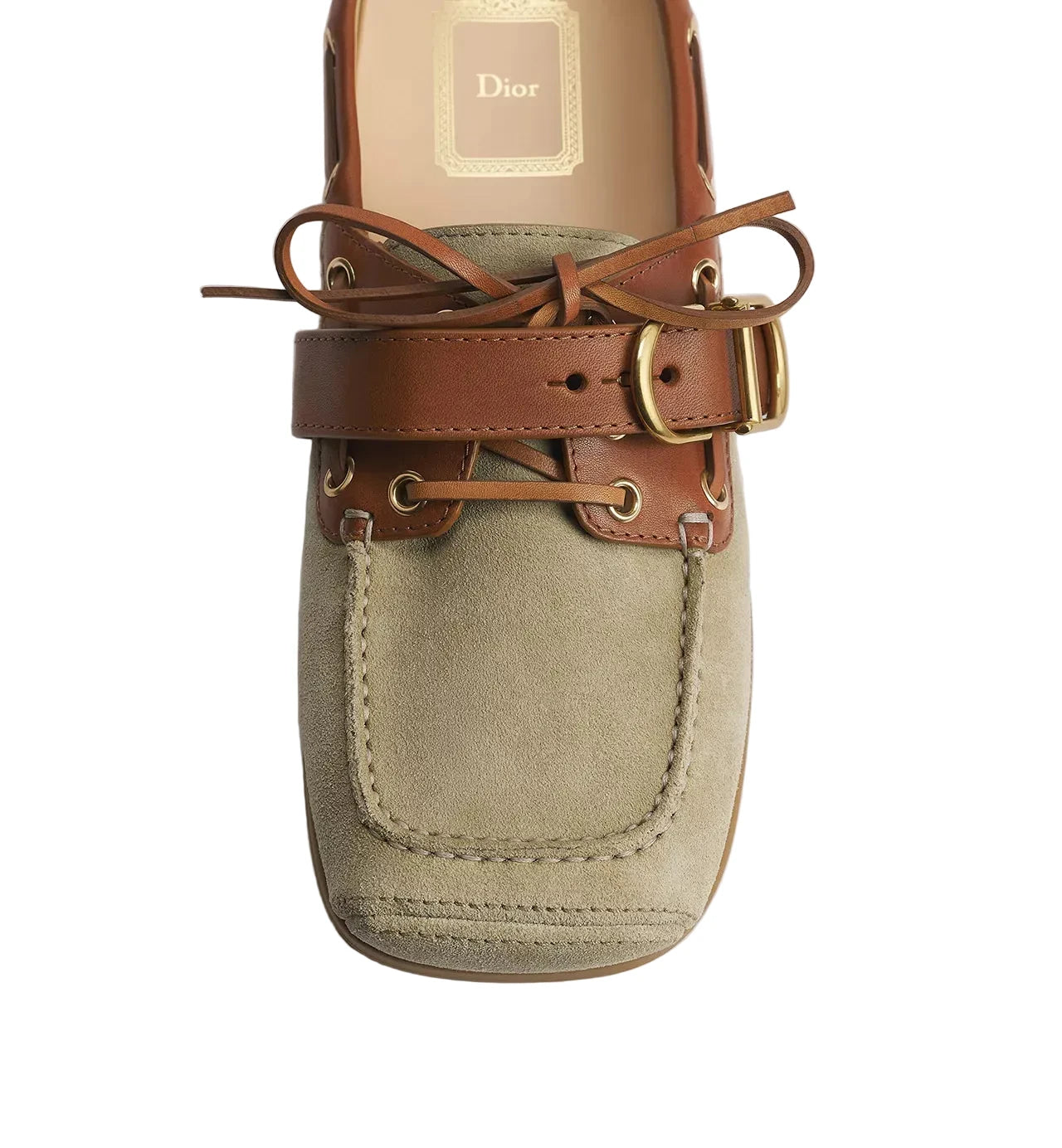 A Dior boat shoe featuring a beige suede upper, brown leather straps, and gold-tone hardware, shown from a top-down view on a light gray background.