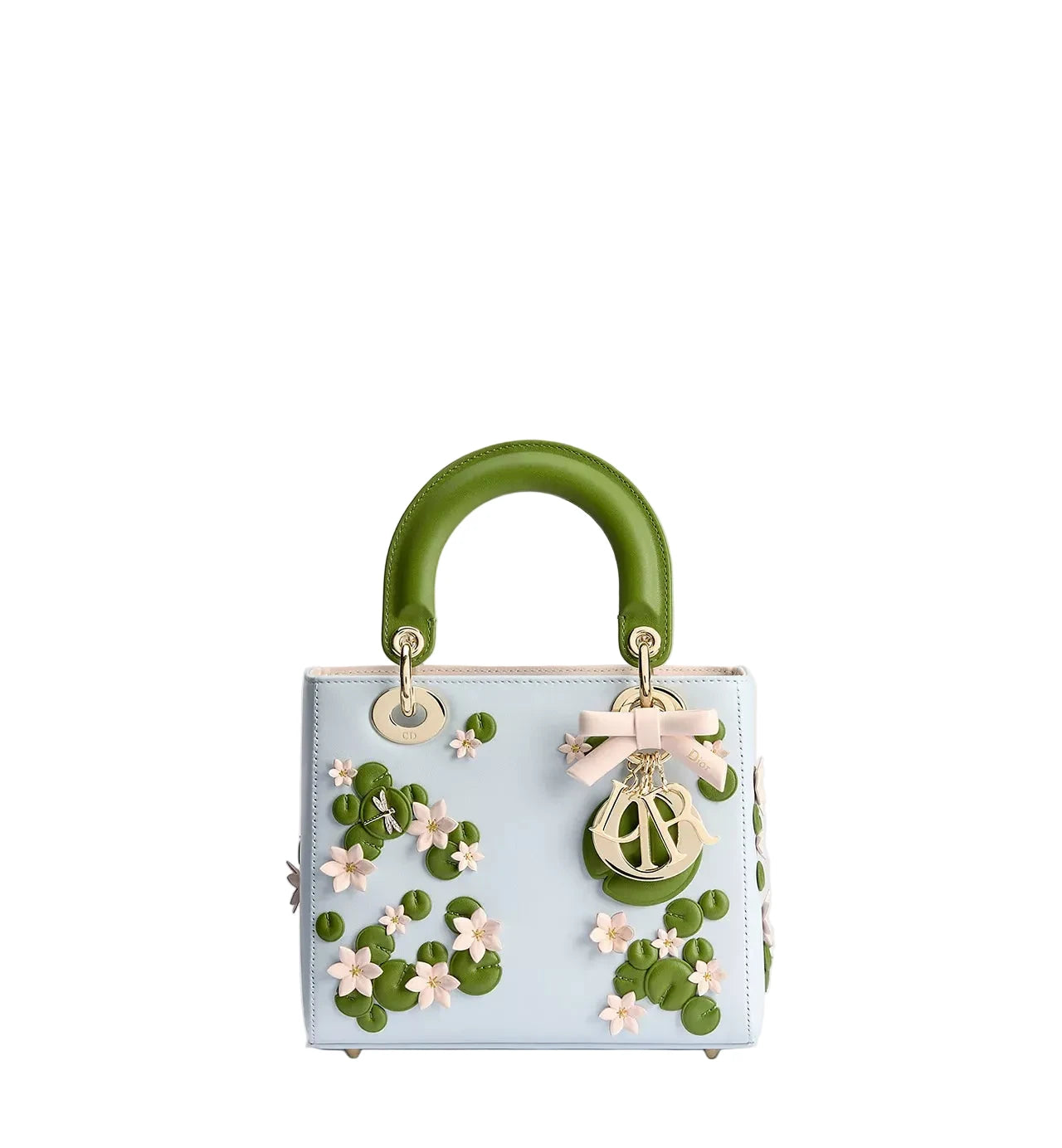 A light blue leather handbag with a glossy green top handle, decorated with 3D green lily pads, pink flowers, and a pink bow with a gold-tone Christian Dior logo charm.