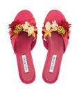 Red sandals with floral and bee decorations on a white background