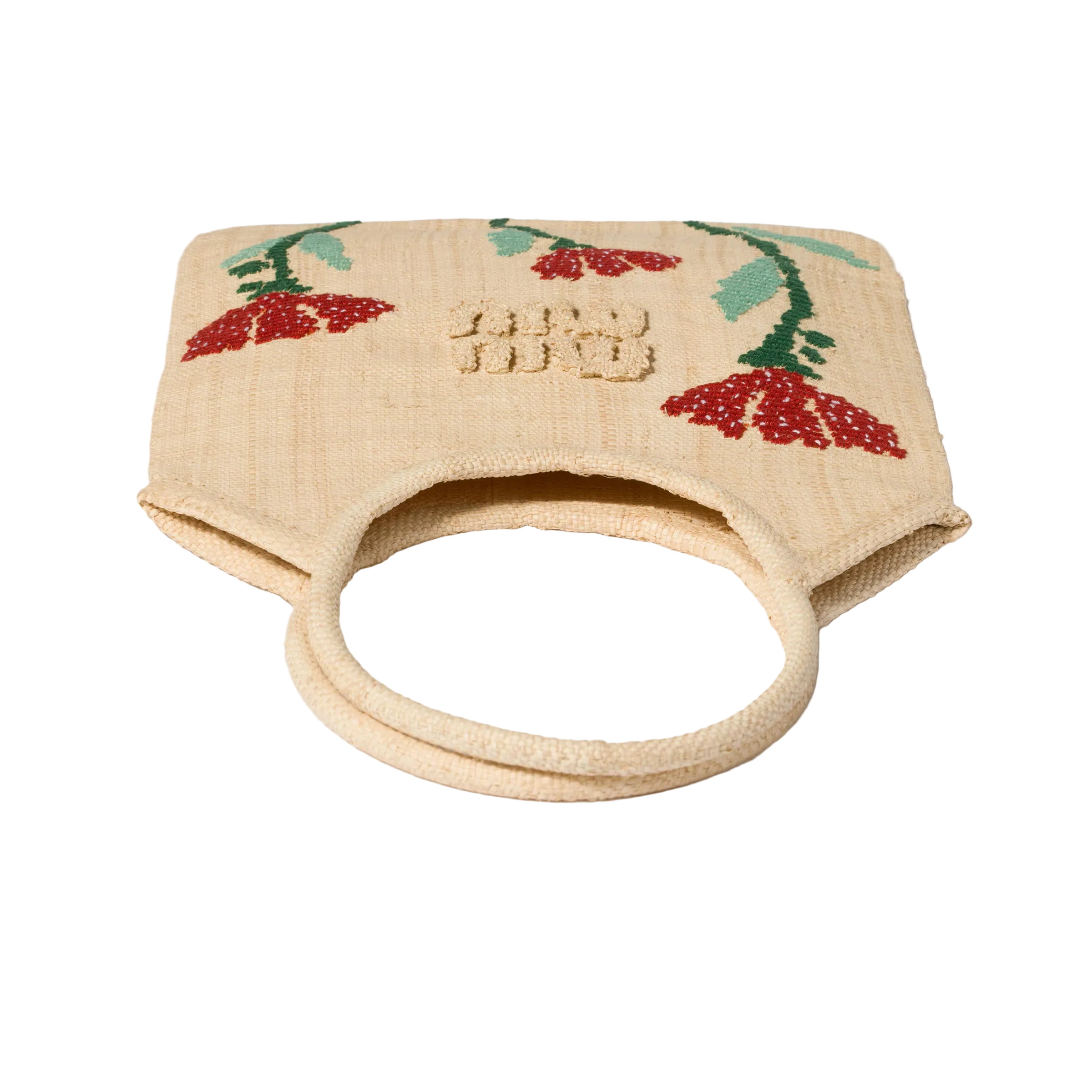 Small beige handbag with floral embroidery on a light background