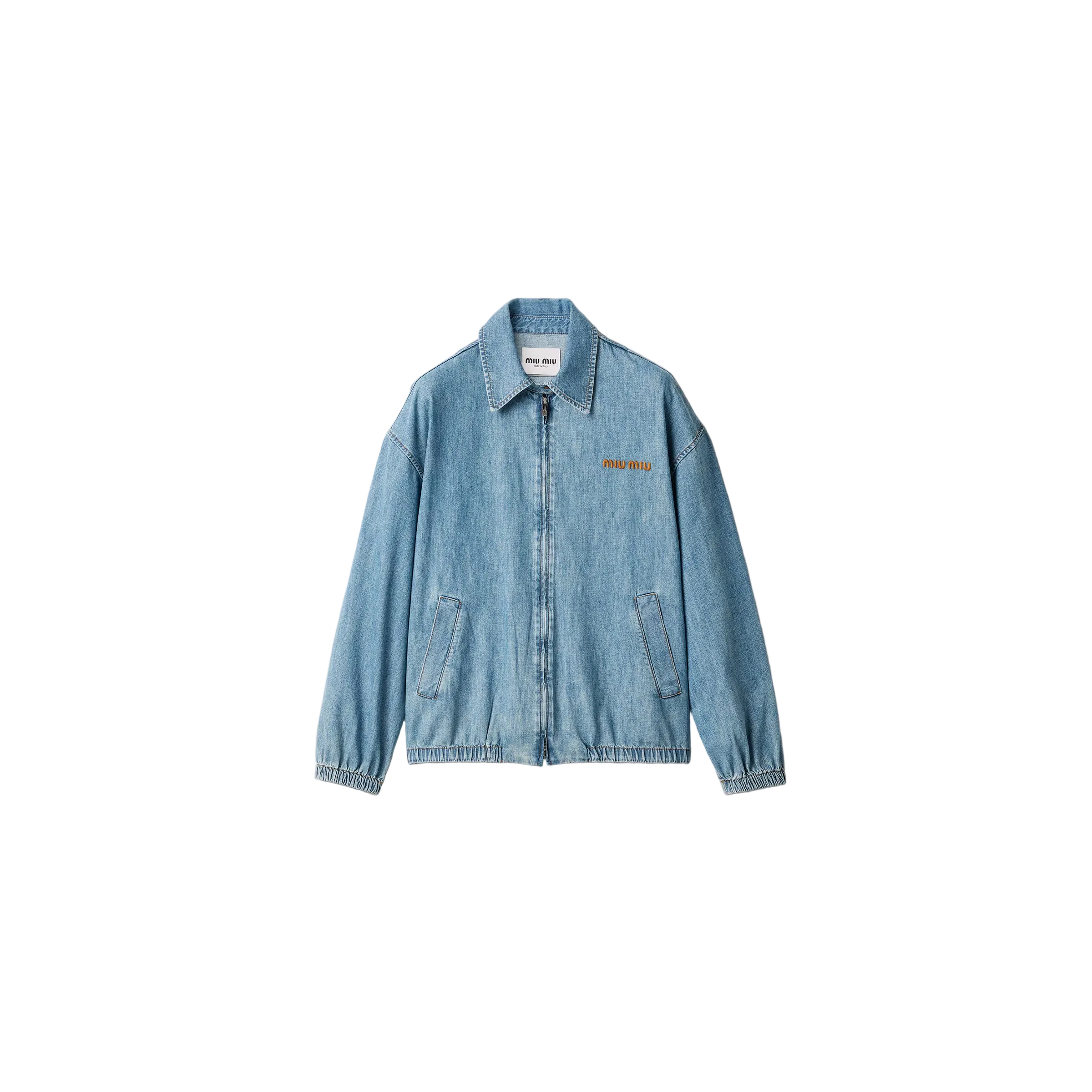 Blue denim jacket on a light beige background