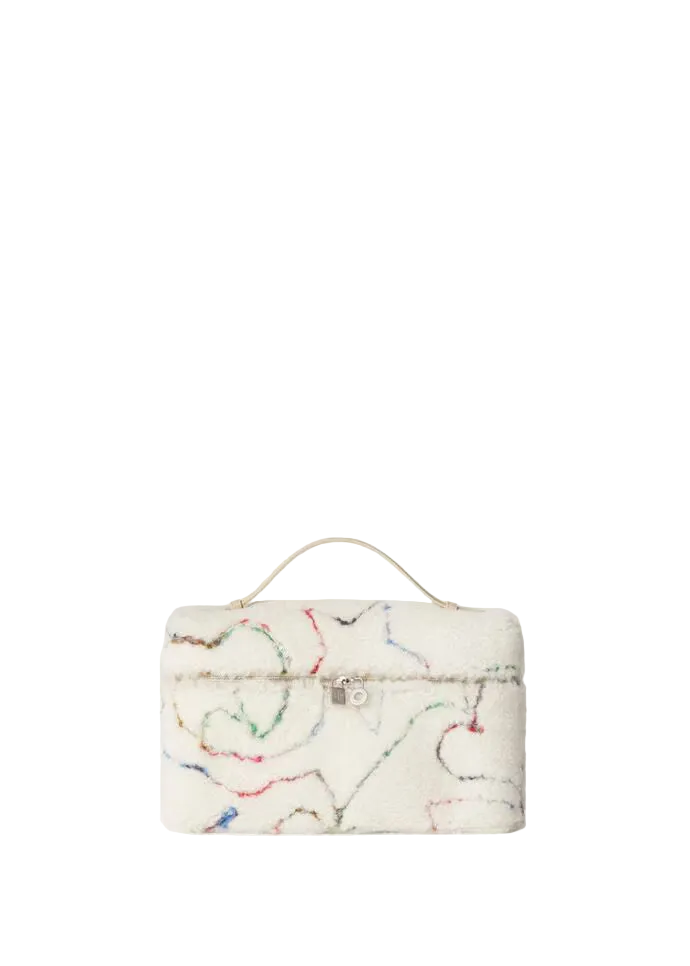 A small white textured handbag with a top handle, decorated with multicolored abstract line drawings, set against a solid off-white background.