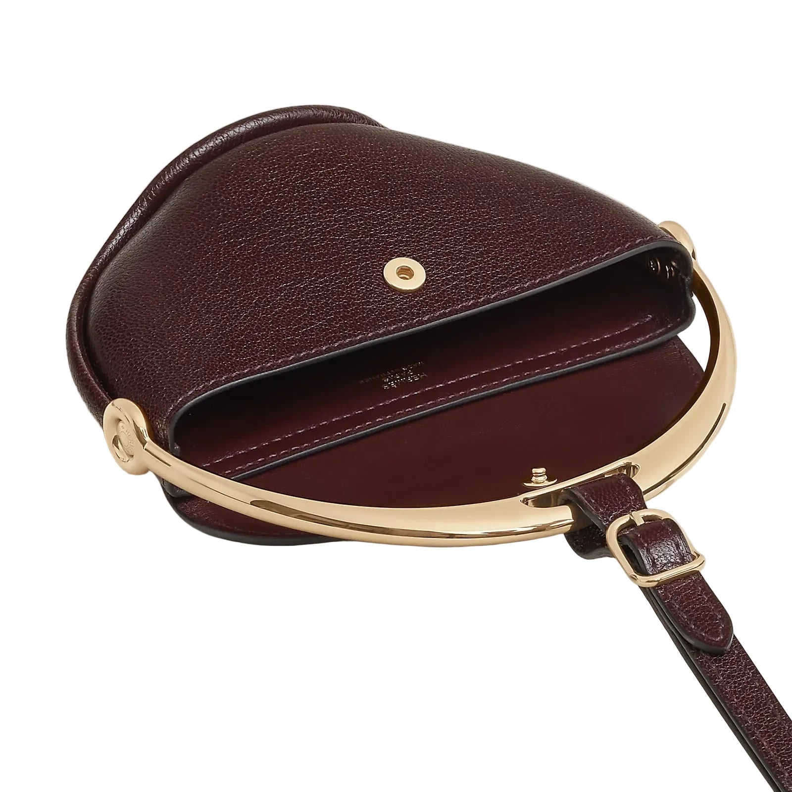 Brown leather handbag with gold accents on a light gray background