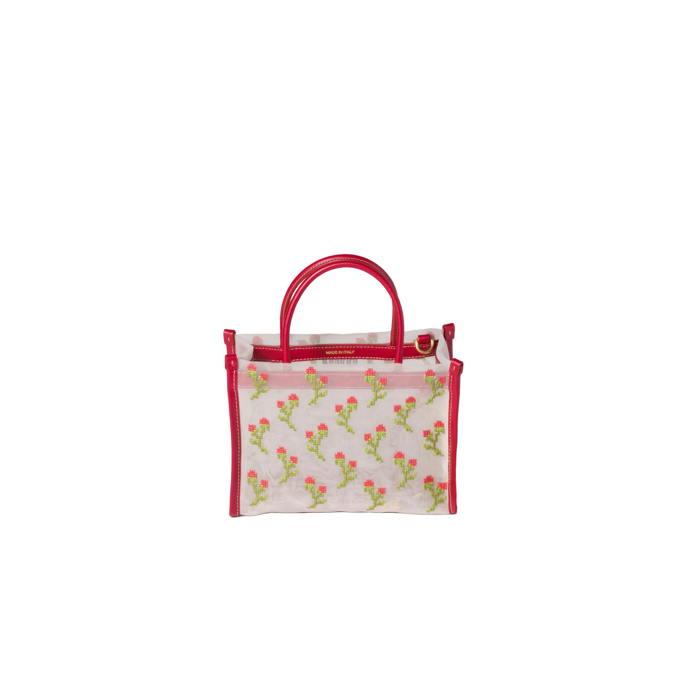 Small handbag with floral pattern and red handle on a beige background