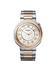 Hermes watch with silver and rose gold band on beige background