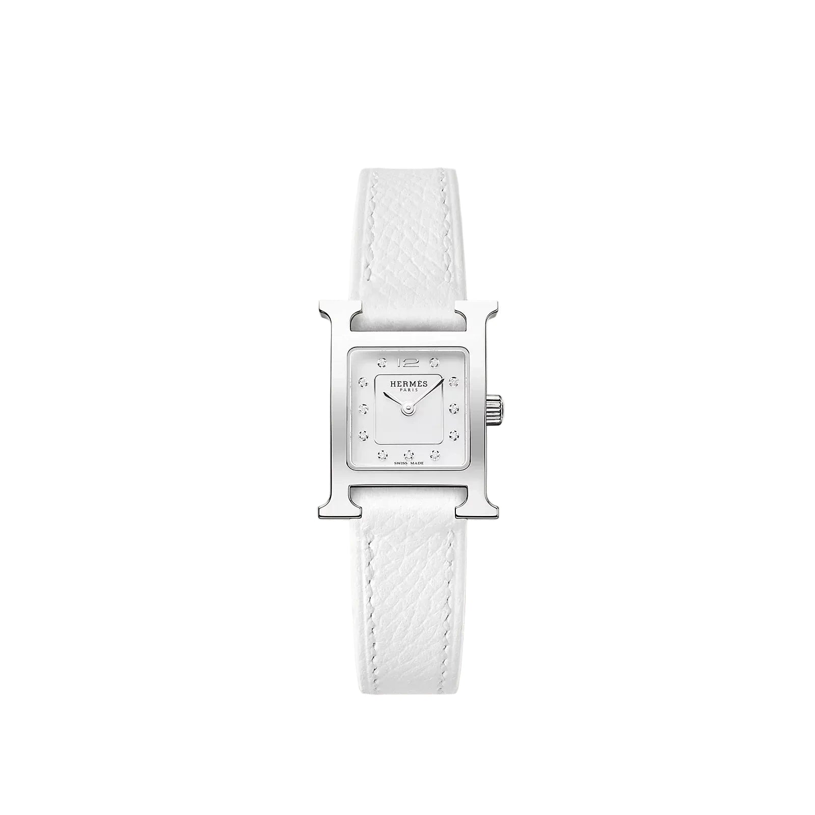 White watch with silver case on a light beige background