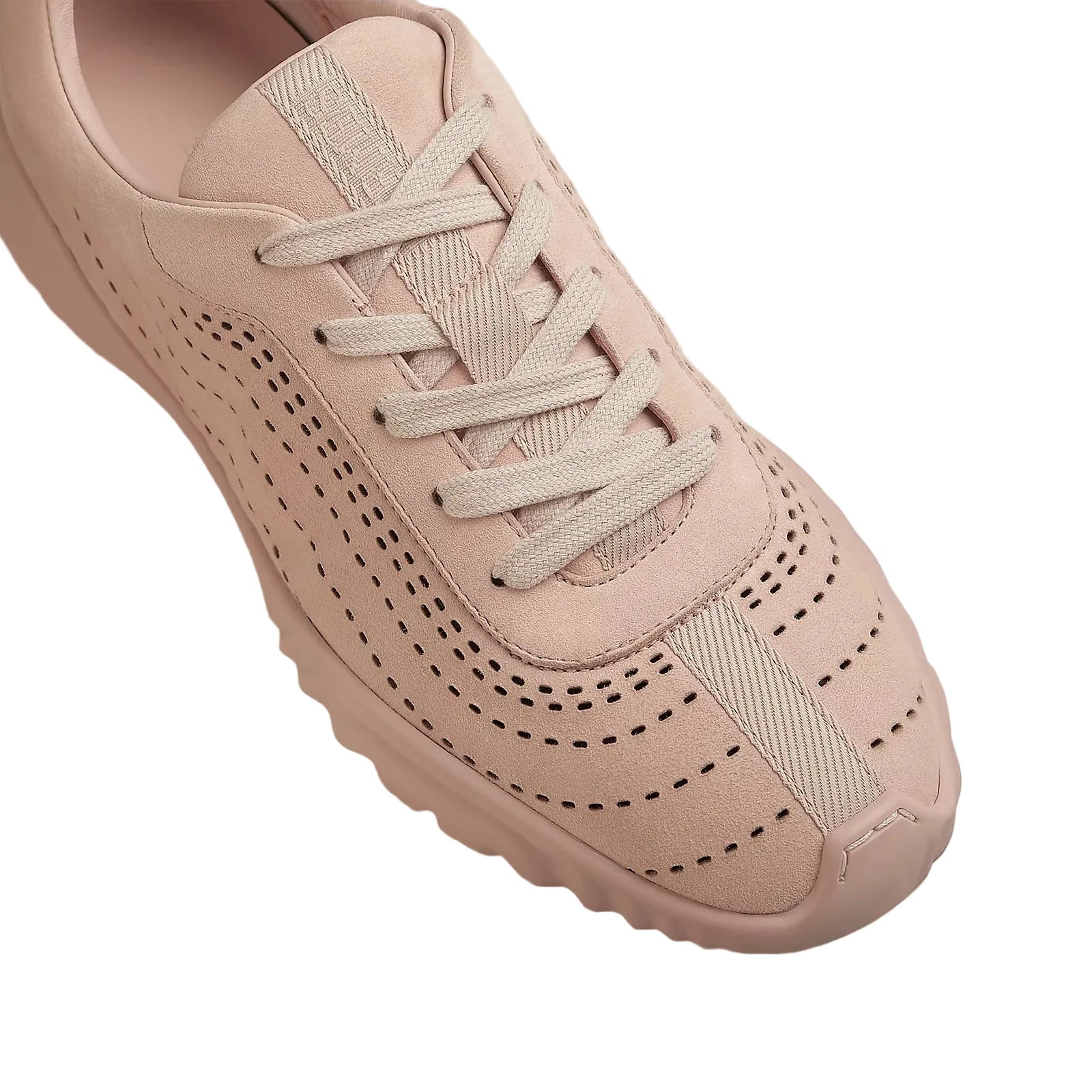 Pink sneaker with lace-up design on a light background