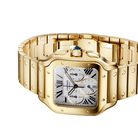 Cartier Santos watch in yellow gold with a silver-toned dial and black Roman numerals, shown on a light cream background.