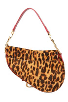 Leopard print handbag with gold chain handle on a white background