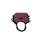 Striped face mask with black trim on a beige background