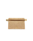Woven napkin holder with gold accents on a white background