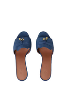 Pair of blue sandals with brown soles on a white background