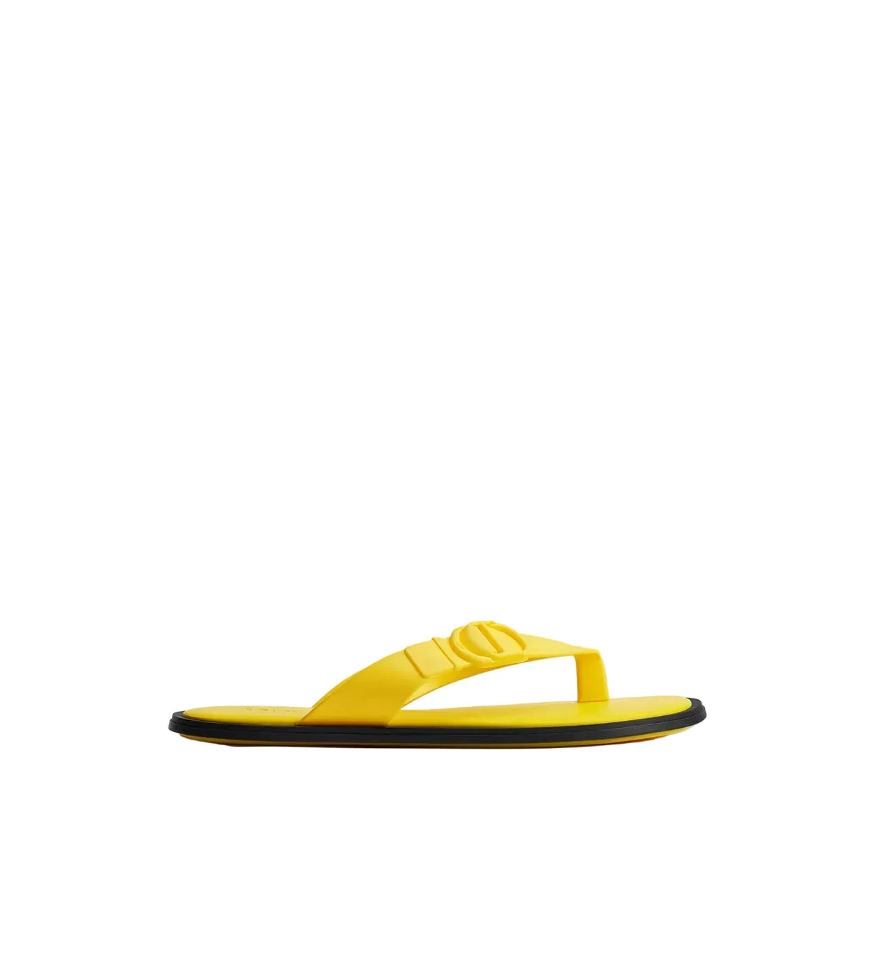 Yellow sandal with black sole on a light gray background