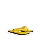 Yellow flip-flops with black soles on a light gray background