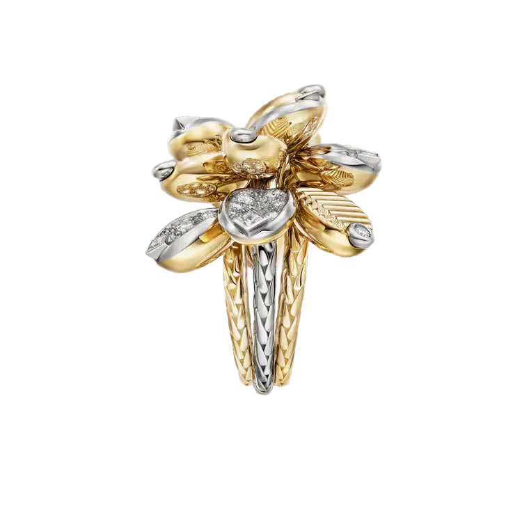 Gold and silver flower-shaped earring on a light gray background