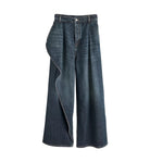 Pair of blue jeans on a light gray background