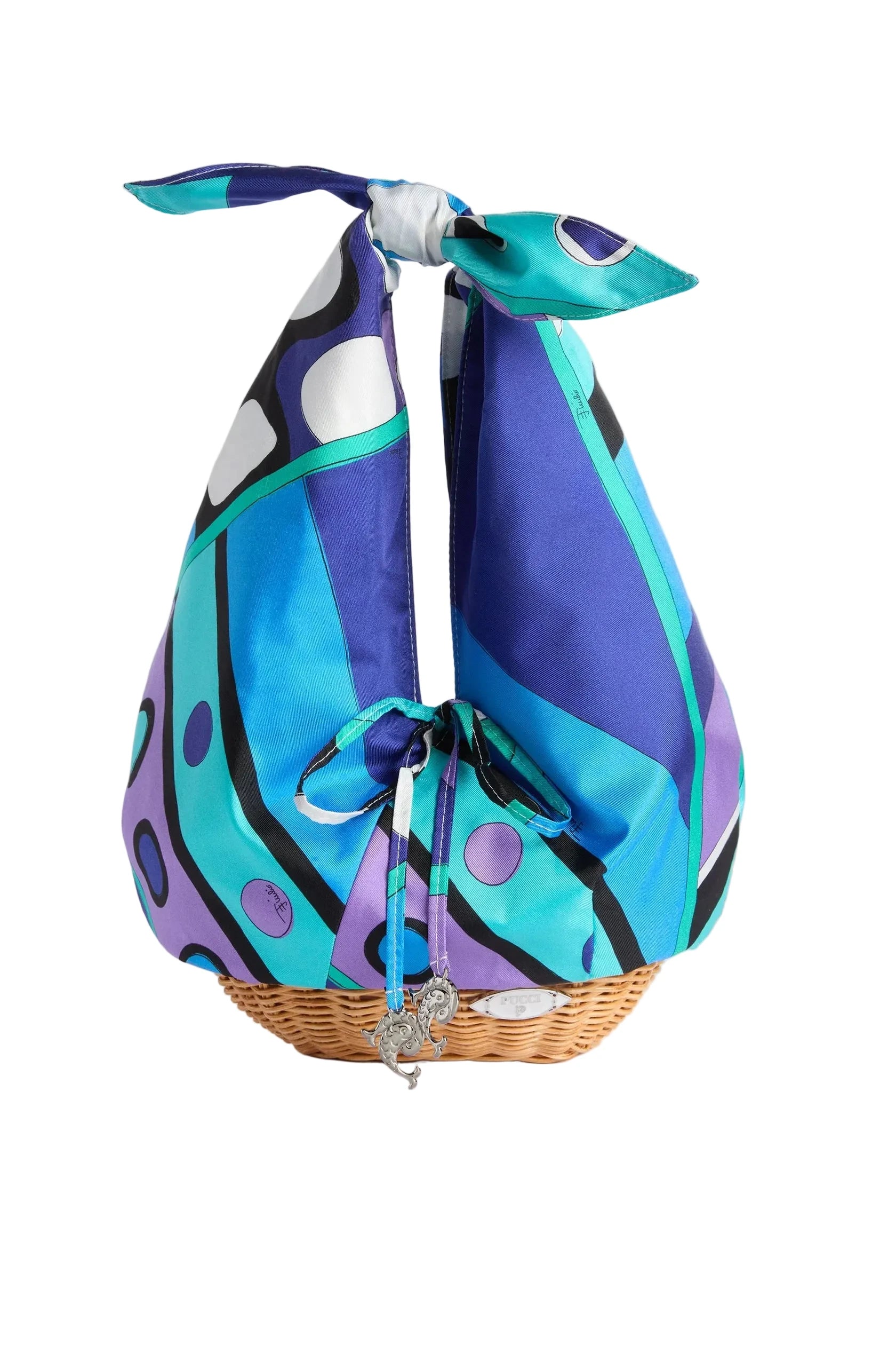 Colorful scarf tied around a wicker basket on a light gray background