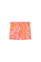 A pair of women's shorts featuring a vibrant retro wavy pattern in orange, pink, and white, displayed flat against a light beige background.