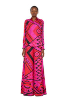 Person wearing a vibrant pink and red patterned outfit on a white background