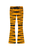 Yellow and black tiger-striped flare pants with small embroidered red and black logo patches, shown flat against a light beige background.