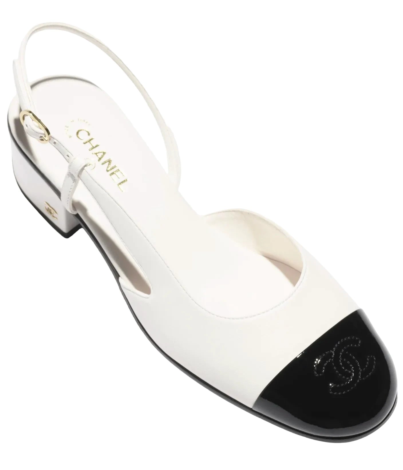 White and black Chanel sandal on a white background