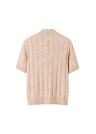 Pink textured shirt on a light beige background
