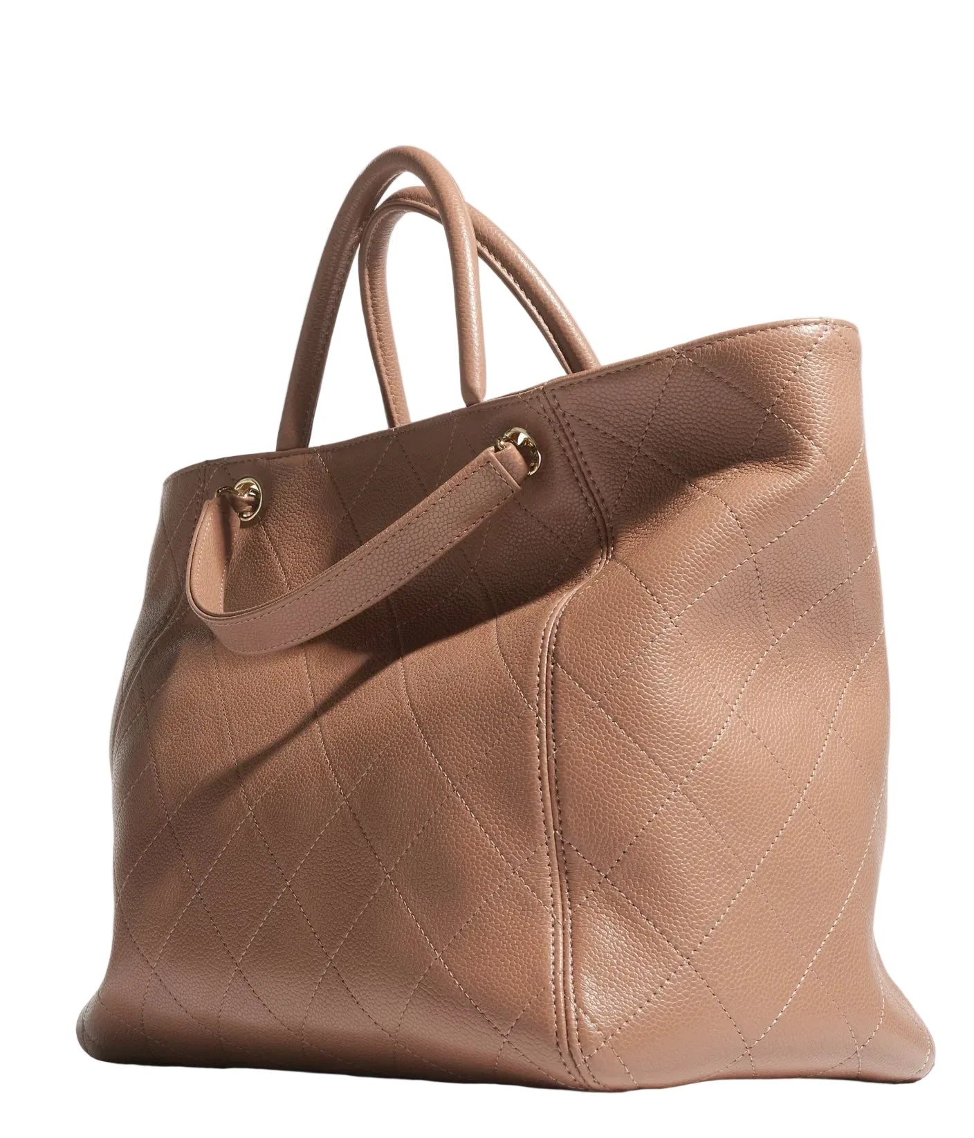 Quilted brown handbag on a light gray background
