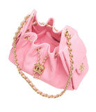 Pink handbag with gold chain and hardware on a white background