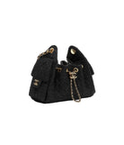 Black handbag with gold chain and hardware on a white background