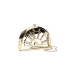 Gold and black clutch bag with chain strap on a white background