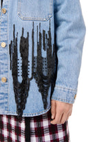 Denim jacket with black distressed design on a white background