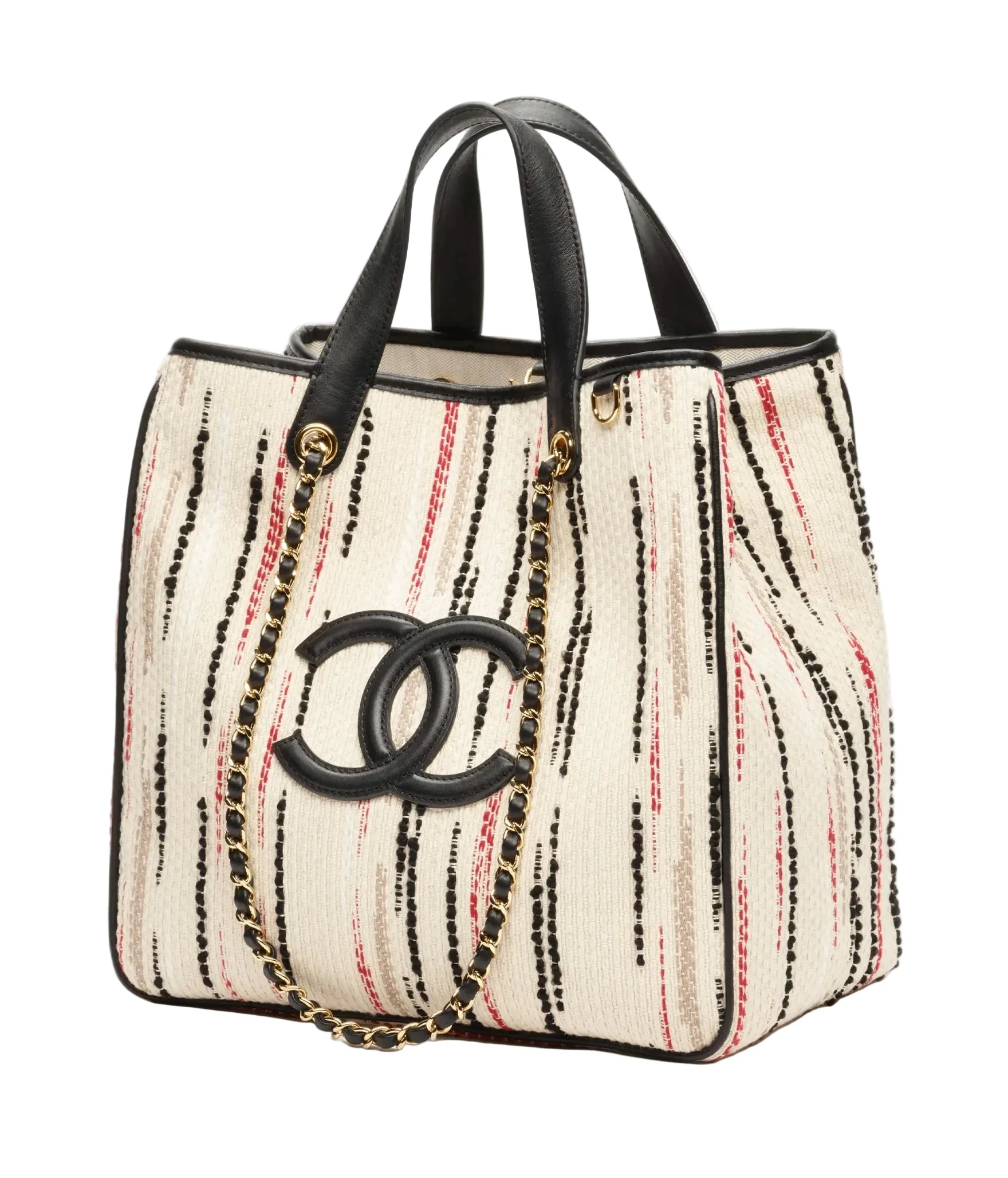Chanel tote bag featuring a cream-colored woven body with vertical black and red stripes, black leather handles and trim, a black interlocking CC logo, and a gold-tone chain strap.